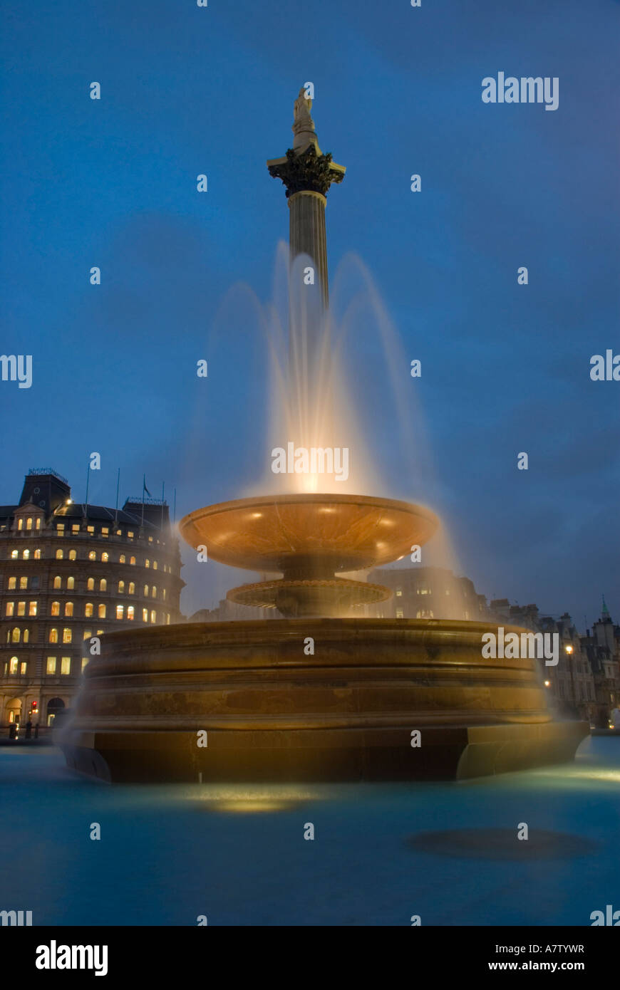 Low angle view of fountain at dusk, Nelsons Column, Trafalgar Square, City Of Westminster, Greater London, London, England Stock Photo