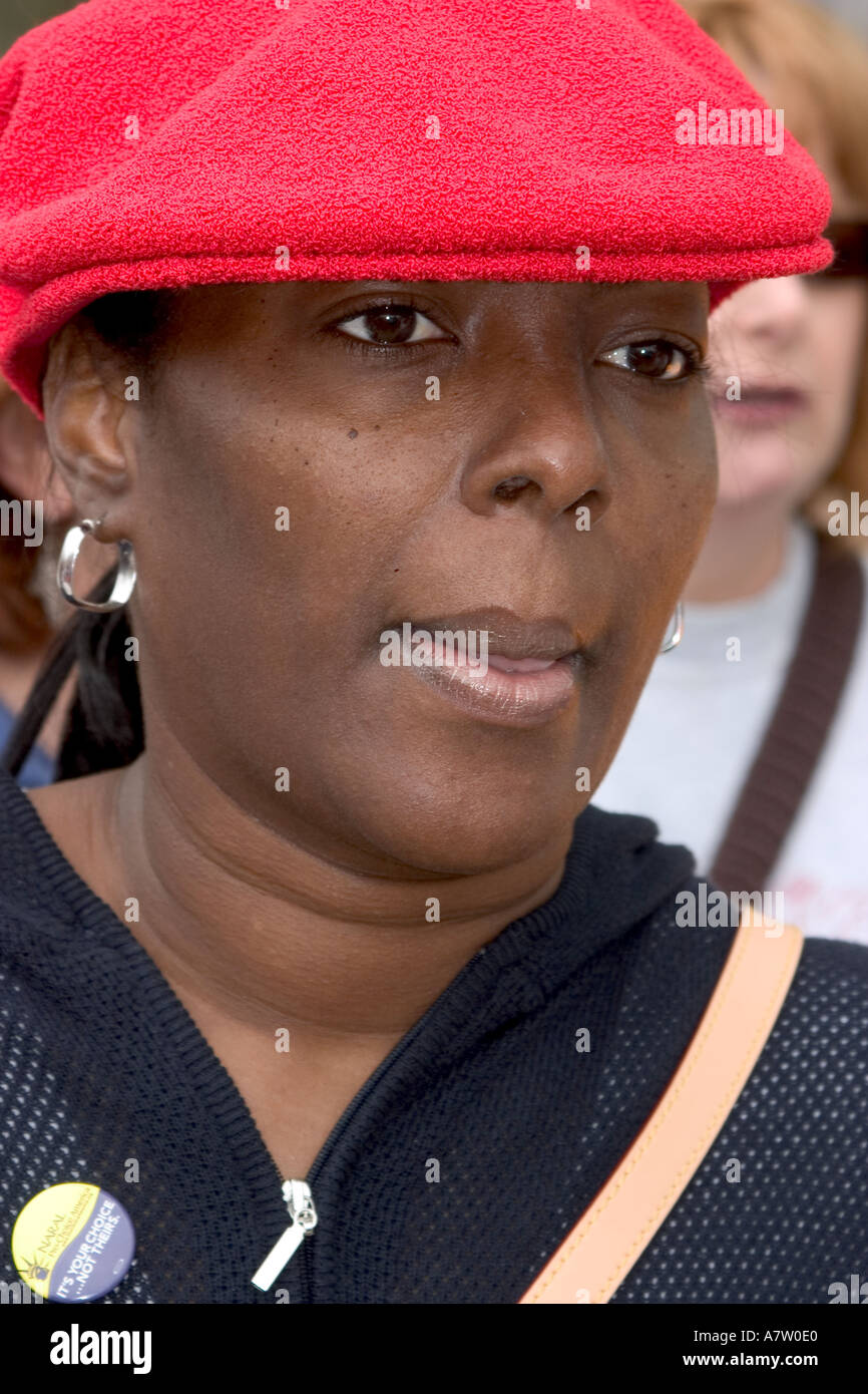 An attractive black woman with a red cap is seen at the pro choice March on Washington DC on April 25 2003 Stock Photo