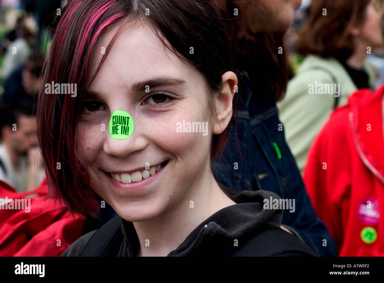 A young woman wears a green pro choice sticker on her nose during a rally in Washington DC Stock Photo
