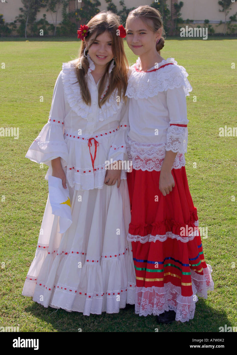 Schoolgirls Wearing Cultural Costumes On UN Day Stock Photo