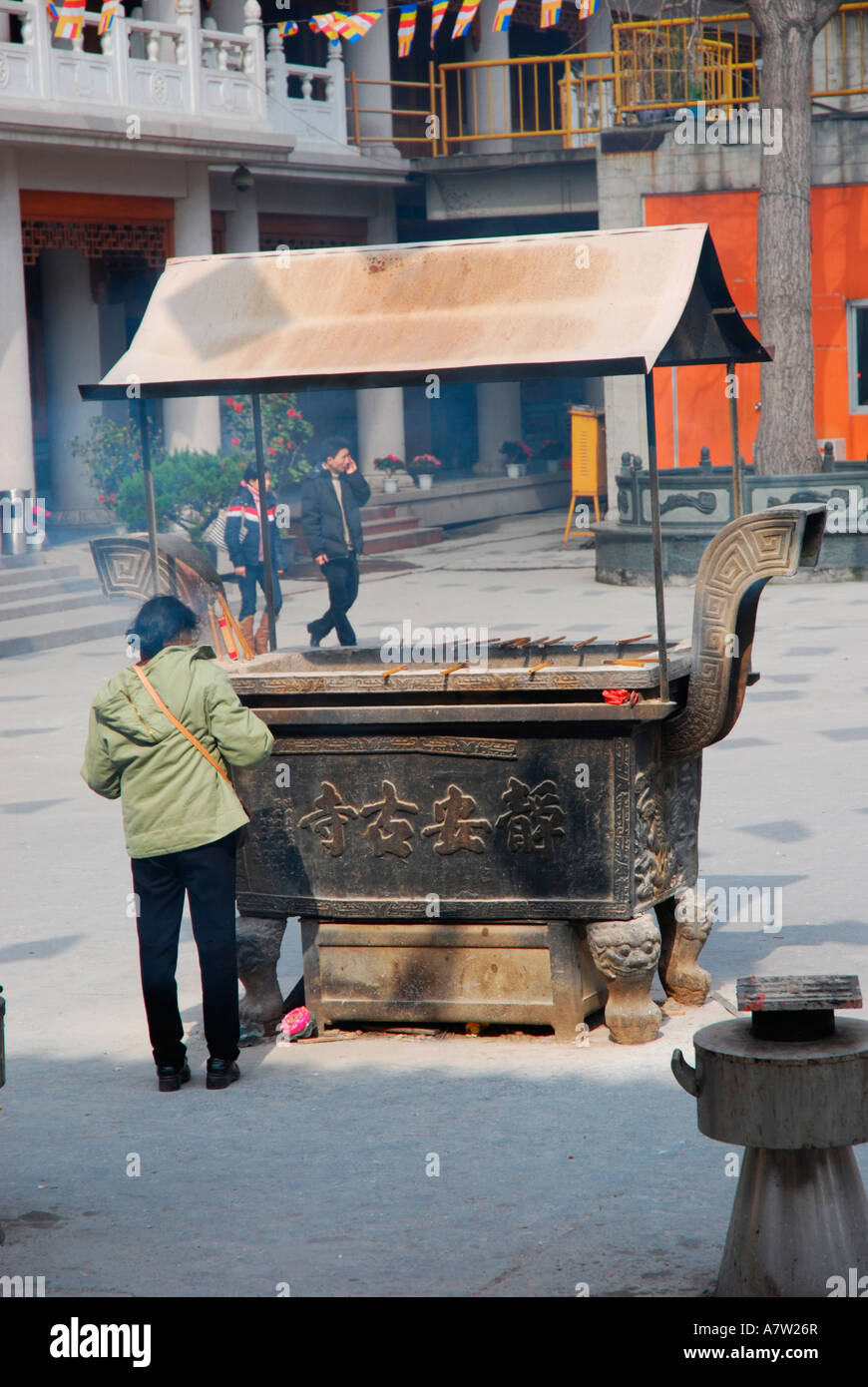 Buddhist woman lighting incense hi-res stock photography and images - Alamy