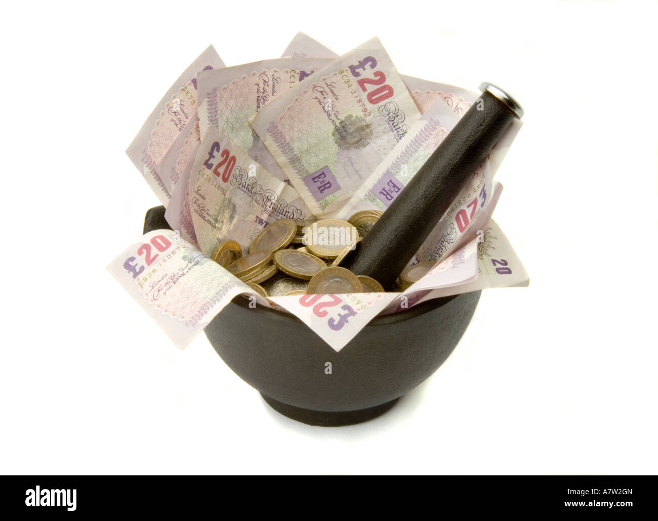 Mortar Pestle Grinding 20 notes with Coins Stock Photo