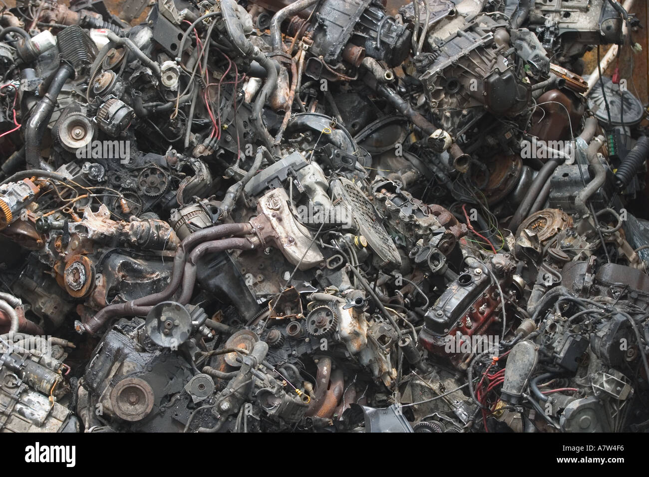 Car engines stacked for recycling Stock Photo Alamy
