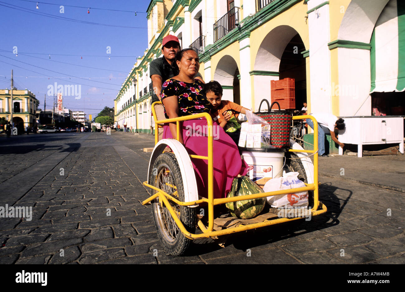 Mexico, Oaxaca State, Juchitan, family on a tricycle on the zocalo Stock Photo