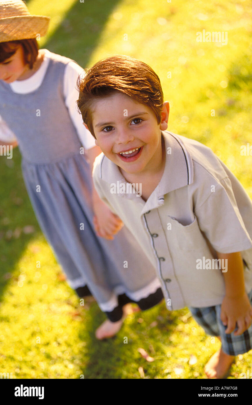 portrait of a boy and a girl standing on a meadow Stock Photo - Alamy
