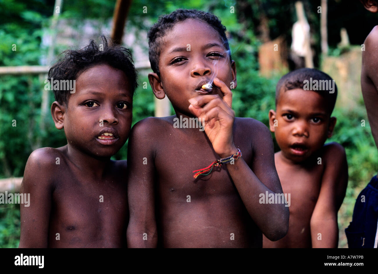 Malaysia, Taman Negara, Orang Asli child (6 years old) smoking Stock ...