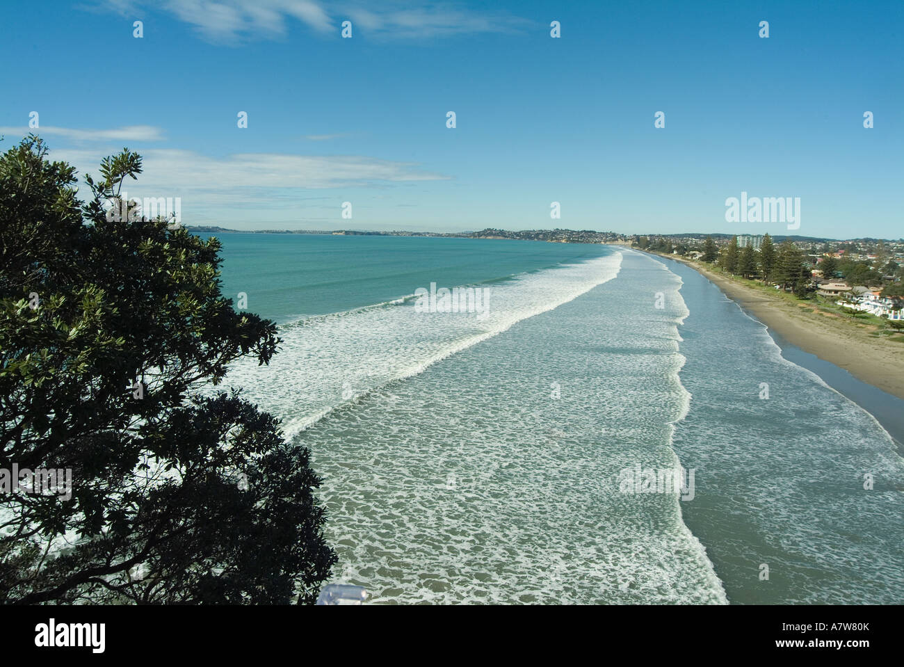 The long beach of Whangaparaoa Bay at Orewa North of Auckland New Zealand Stock Photo