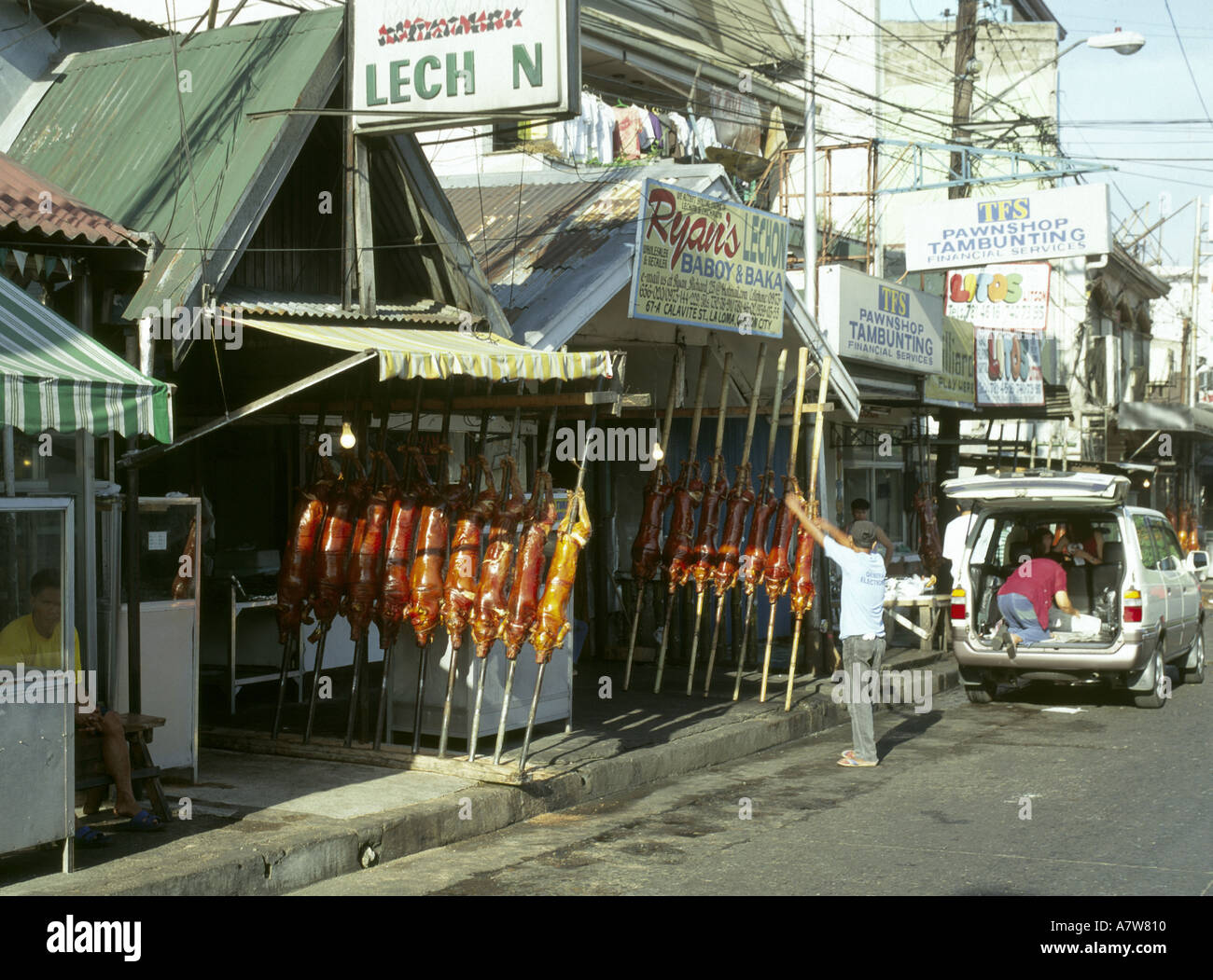 Philippines Manila selling fresh cooked pork Stock Photo - Alamy