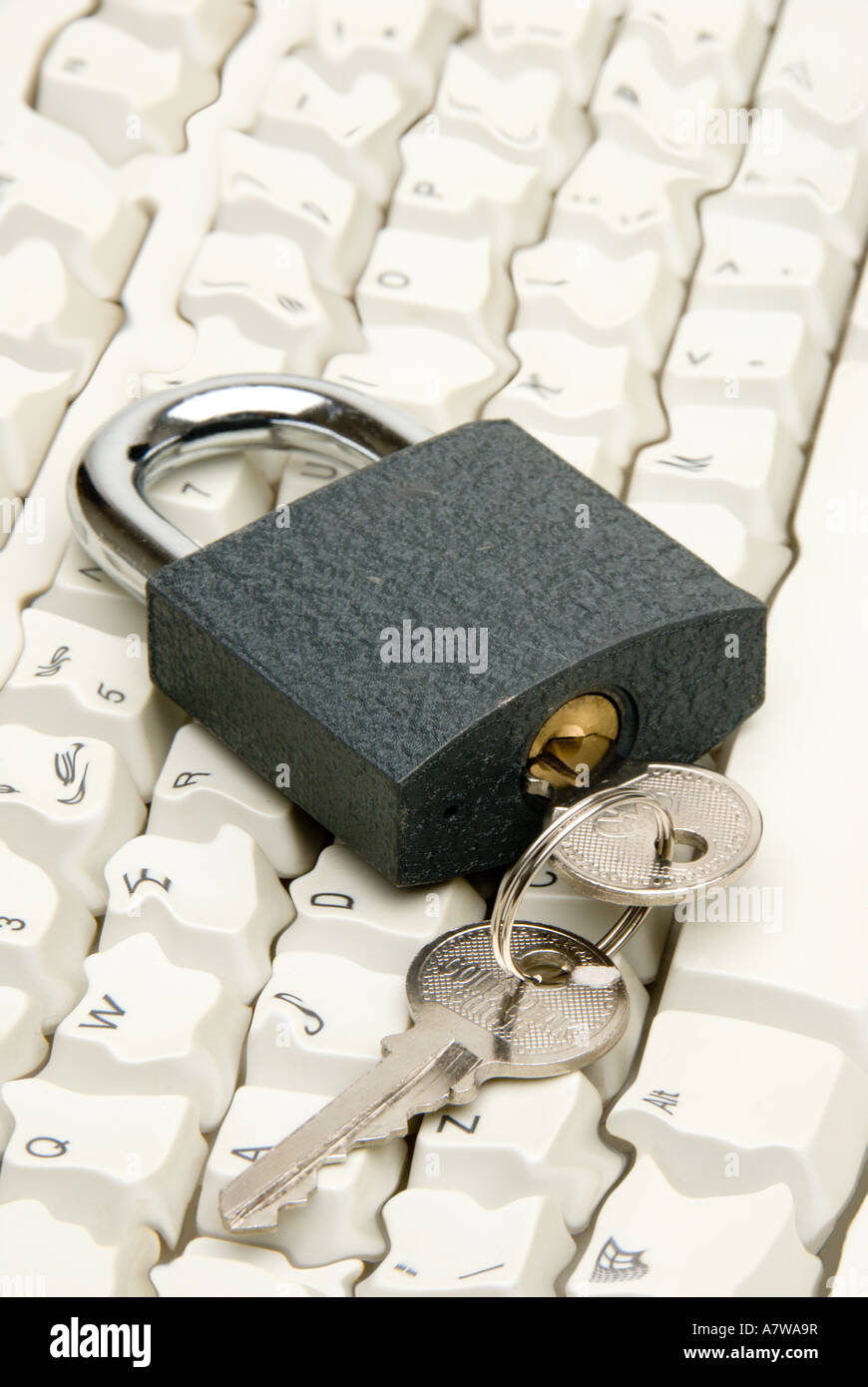 Computer keyboard digitally manipulated with key in lock - computer security concept. Stock Photo