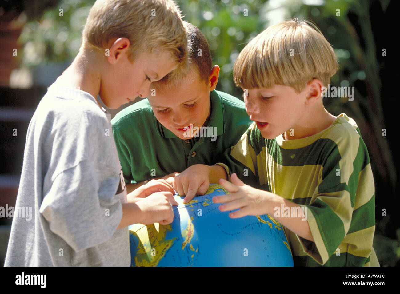 Three boys playing outside hi-res stock photography and images - Alamy