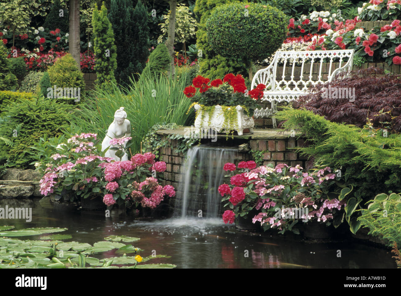 Water Feature in Garden with Pond and Waterfall Stock Photo