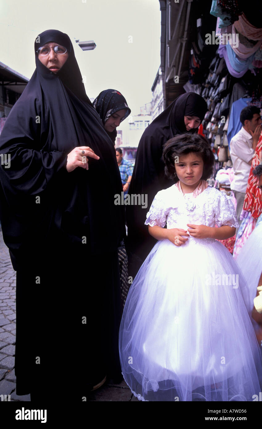Traditional Islamic dressed woman and daughter Istanbul Turkey Stock Photo
