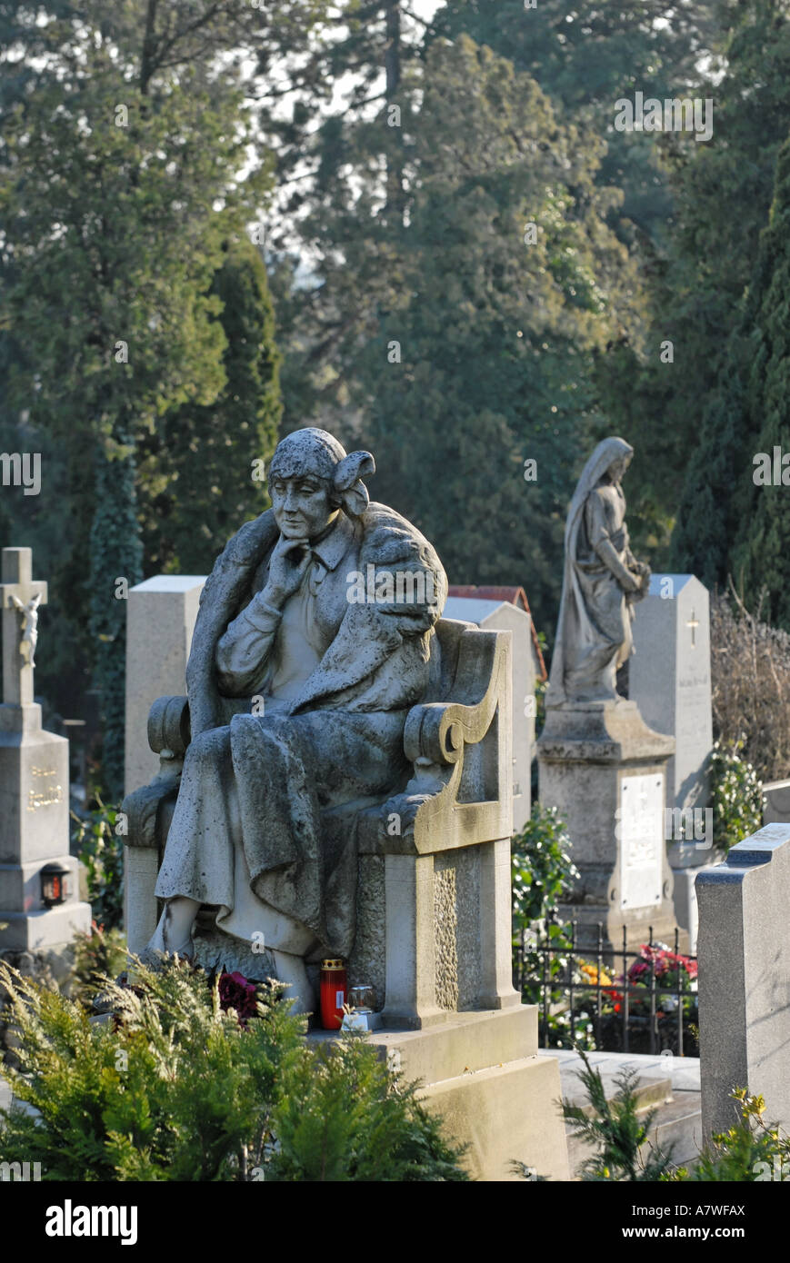 Sculpture of sitting lady as gravestone, graveyard, cemetery Stock