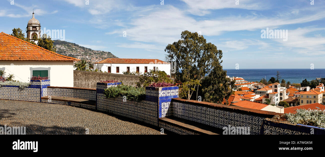 View over a square decorated with Azulejos to the old town and the church tower of the Convento de Santa Clara, Funchal, Madeir Stock Photo