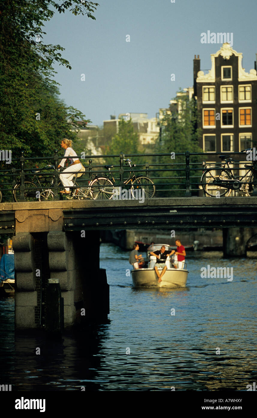 Cyclist canal amsterdam netherlands hi-res stock photography and 