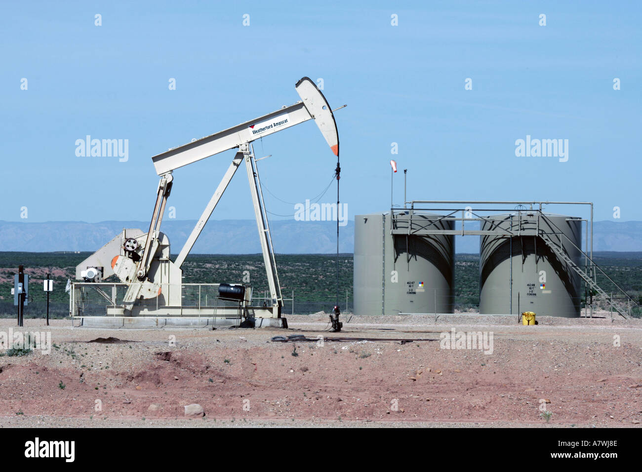 Oil well and storage tanks in northwest Texas Stock Photo Alamy