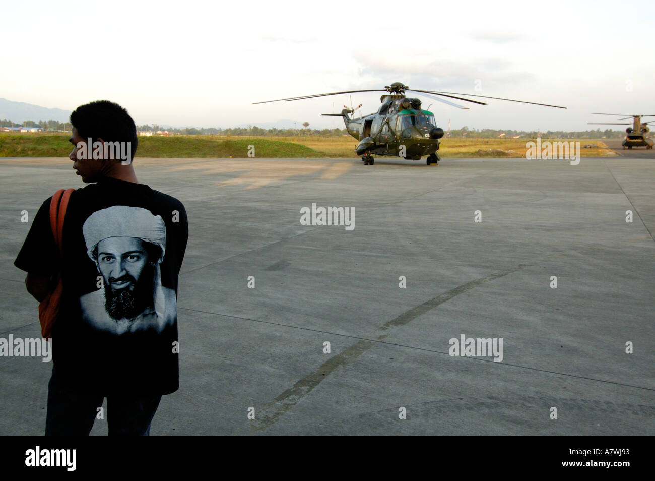 Indonesia Sumatra Banda Aceh Post Tsunami UN helicopters and Osama Bin Laden T shirt at the airport Stock Photo