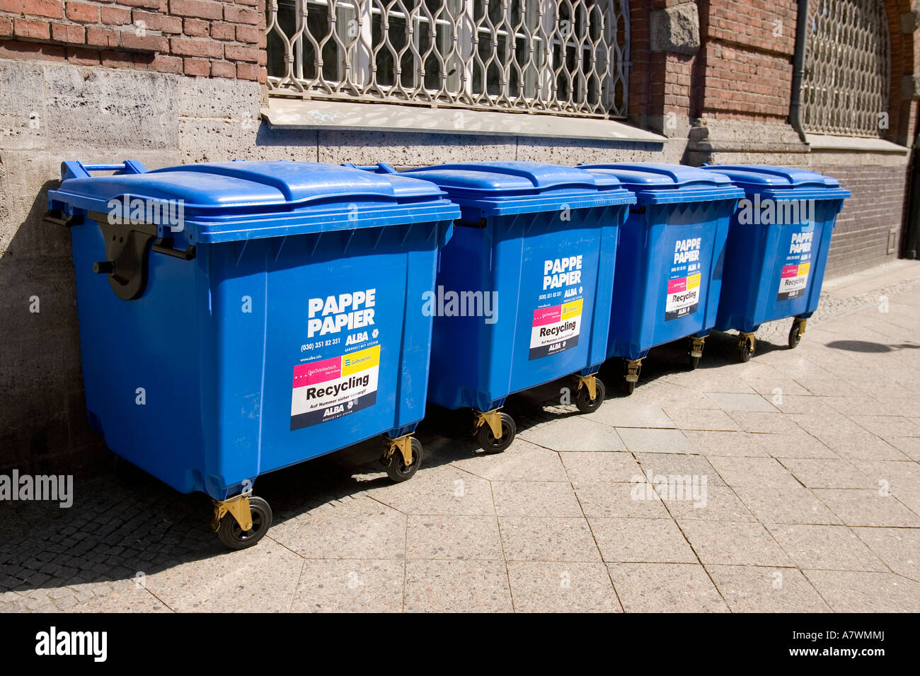Blue recycling container for paper waste Stock Photo