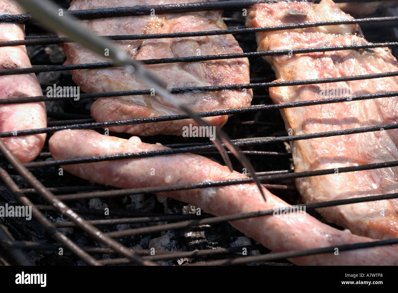 Grilled meat on barbecue grill Stock Photo - Alamy