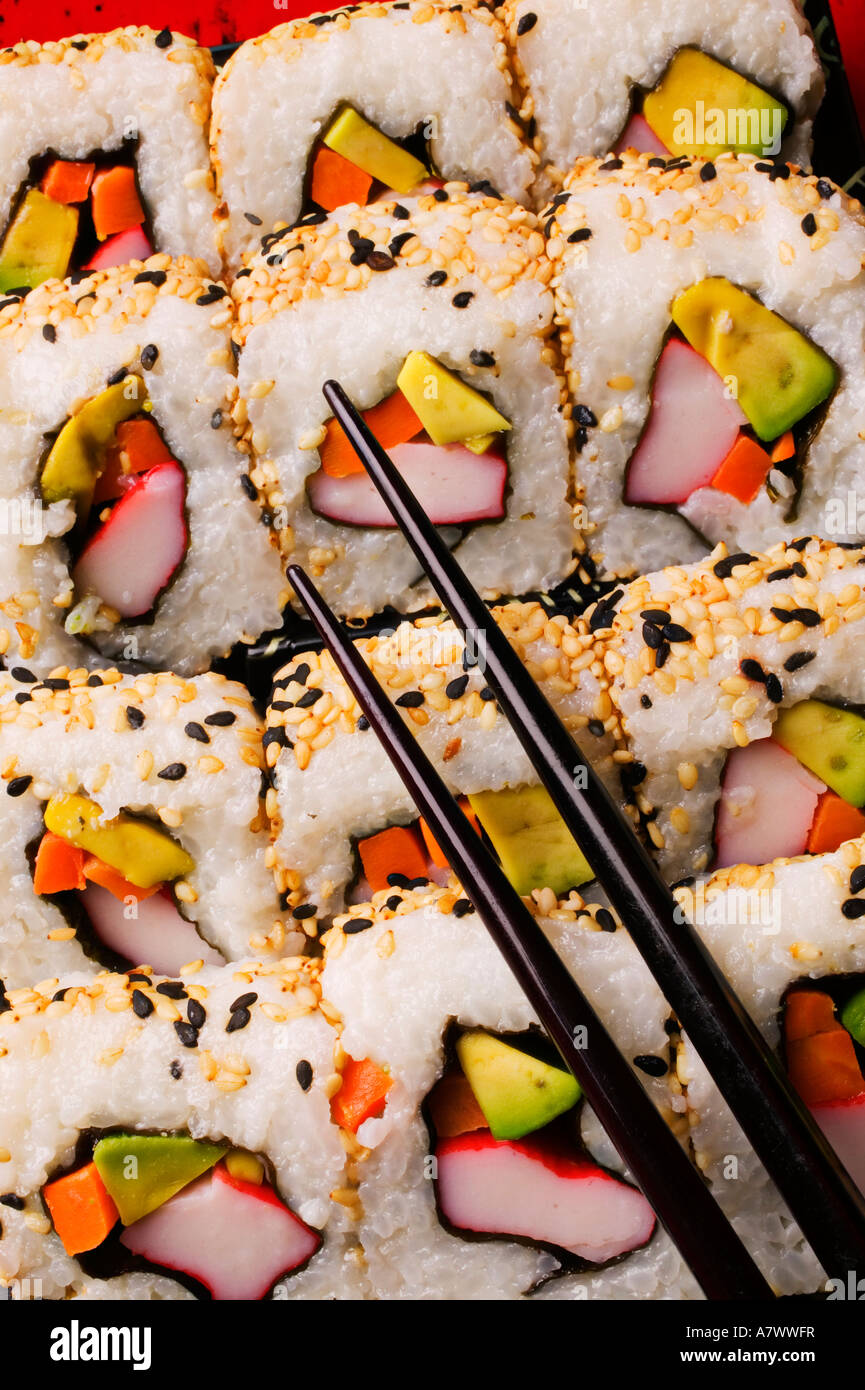 Sushi with chopsticks Stock Photo Alamy