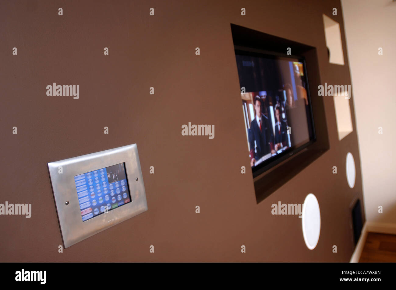 A CONTROL PANEL IN A SMART HOUSE WITH INTEGRATED SYSTEMS OF SECURITY AUDIO VISUAL HEATING AND LIGHTING UK Stock Photo