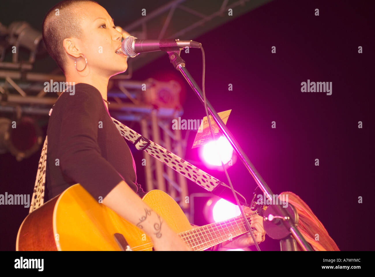 Close Up Portrait Of Jun Female Vocalist For Chinese Rock Band Neon Singing On Stage Taiwan China Stock Photo