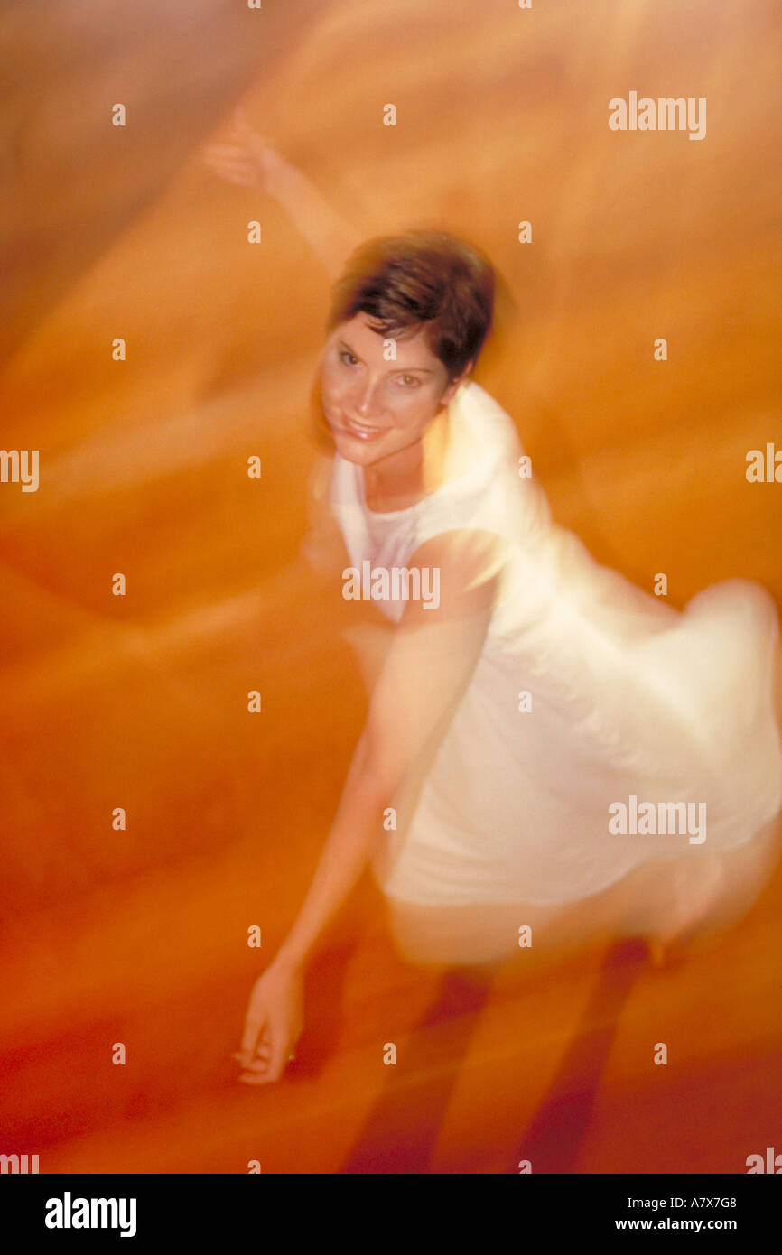 portrait of young woman spinning around Stock Photo Alamy