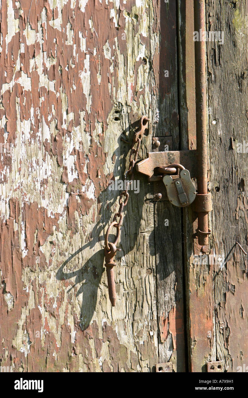 Storage container door securely padlocked and chained shut Stock Photo