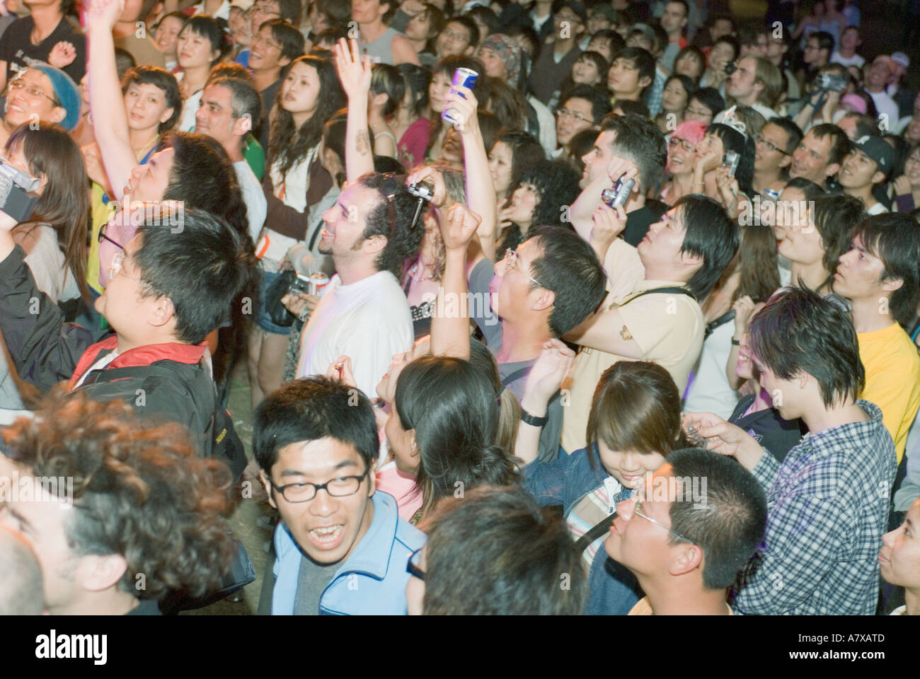 Multiethnic crowd listening to and watching live music concert Taiwan China Kenting Spring Scream Stock Photo