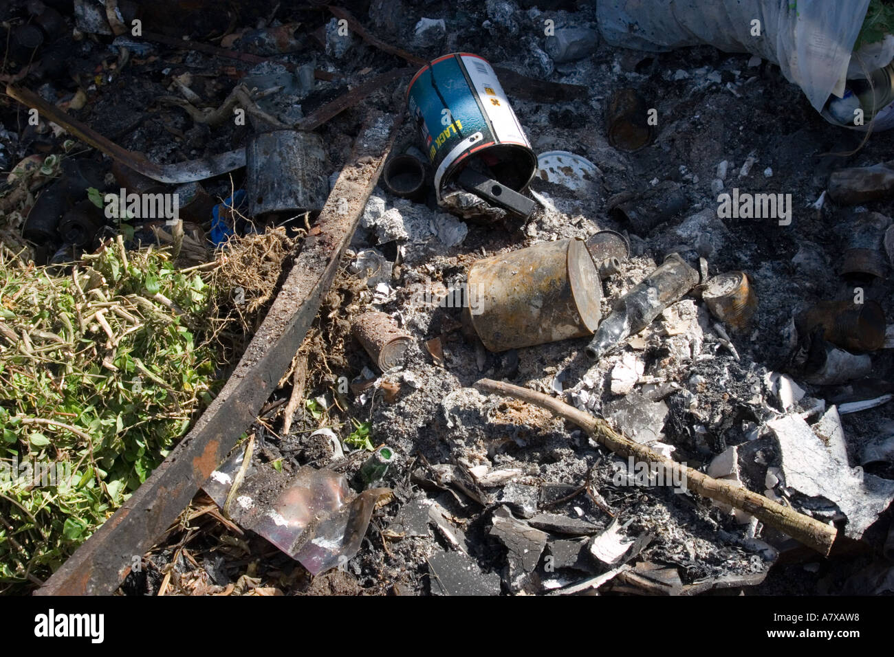 The burnt contents of a rubbish skip Stock Photo - Alamy