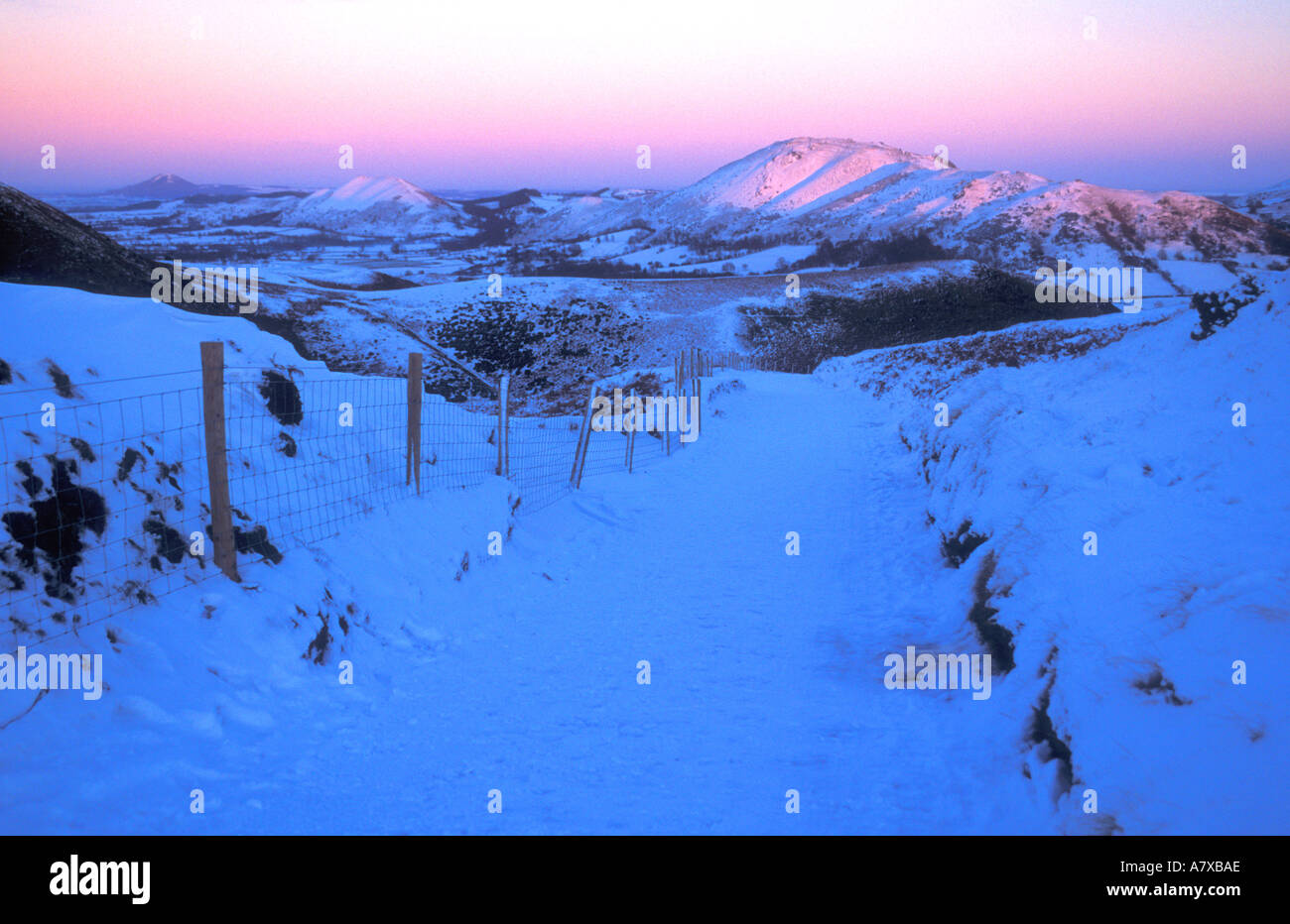 Shropshire Hills from the Long Mynd Church Stretton Shropshire England in winter snow at sunset UK GB Stock Photo