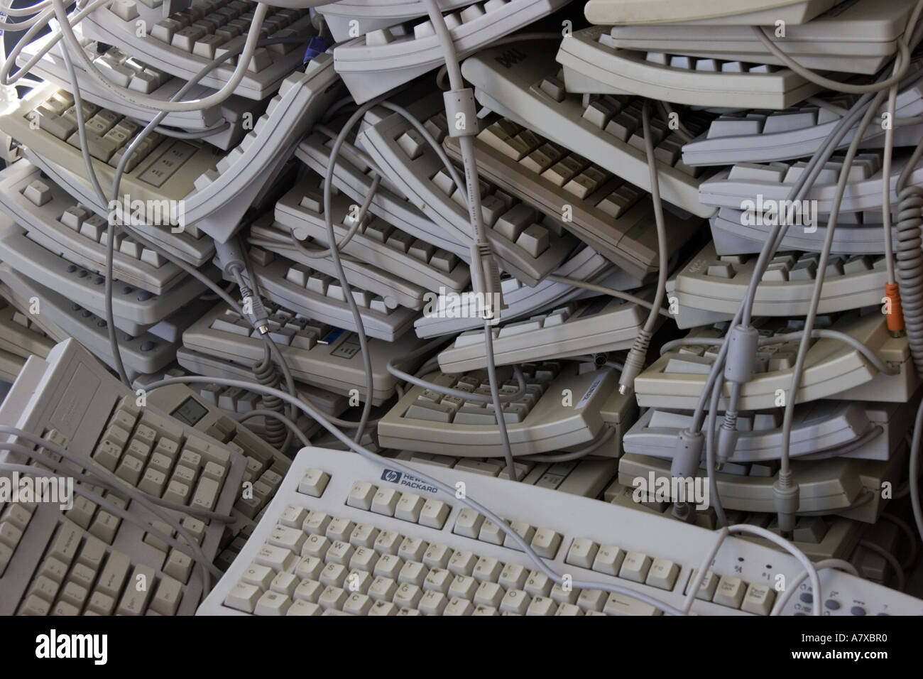 Pile of old computer keyboards for recycling Stock Photo