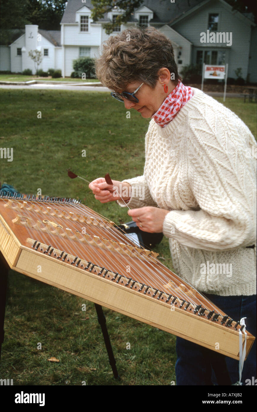 EVENTS Wauconda Illinois Woman play hammer dulcimer trapezoid shape  stringed instrument played with hammers Stock Photo - Alamy