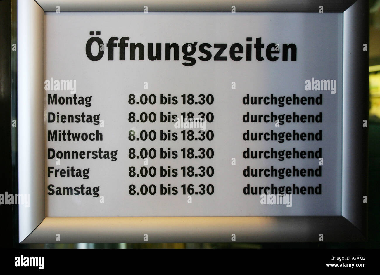 opening hours at shop in switzerland. (c) by uli nusko, ch-3012 bern Stock Photo