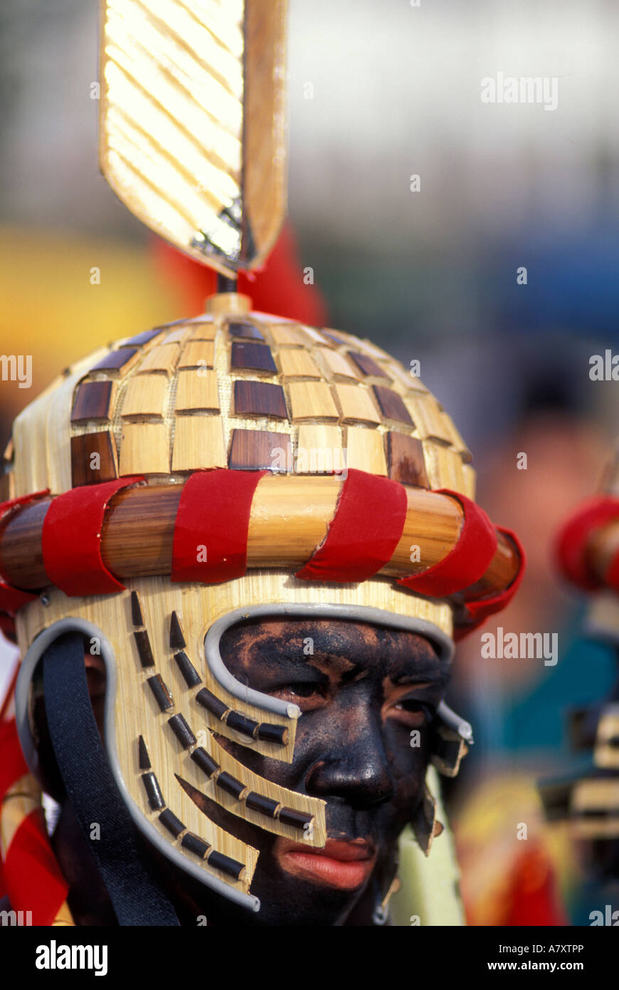 Philippines, Dancer wears black face and elaborate costume at Dinagyang Festival in Iloilo on Panay Island. Stock Photo