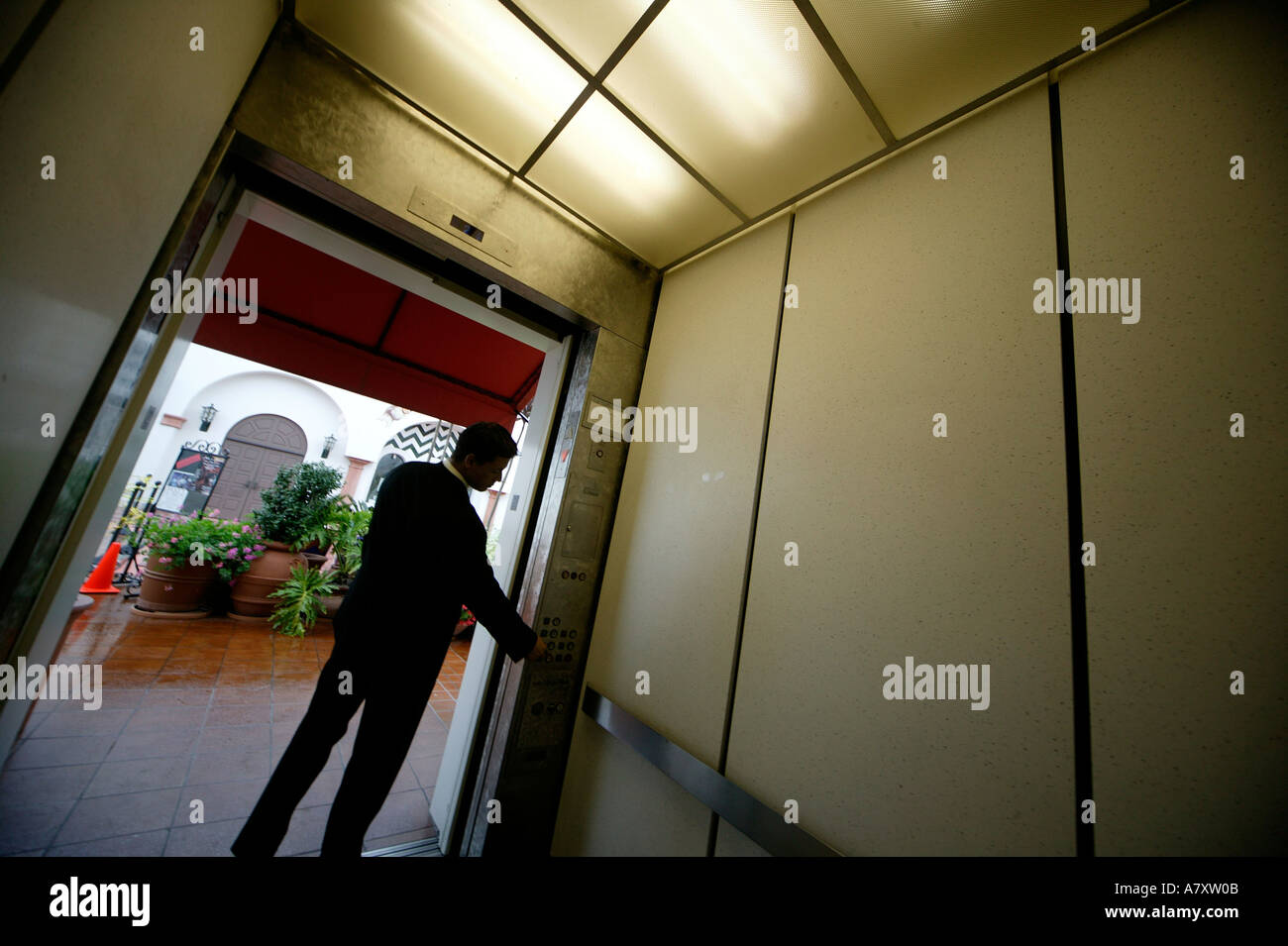 Man/businessman in a lift/elevator Stock Photo