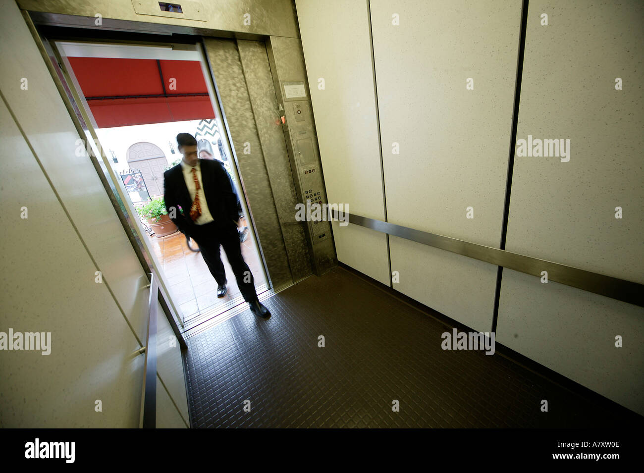 Man entering a lift/elevator Stock Photo
