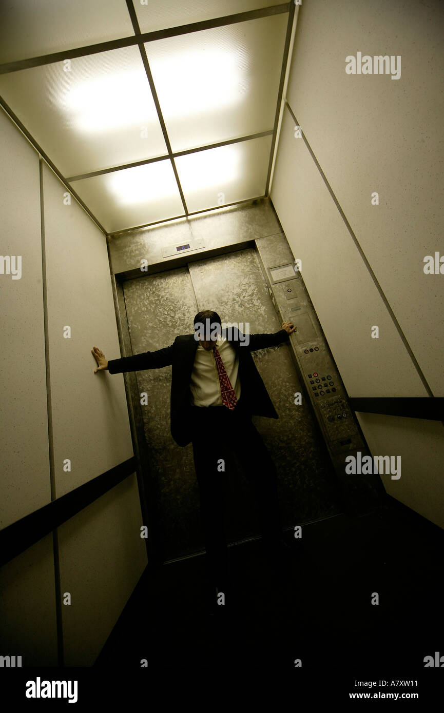 Businessman in a lift/elevator Stock Photo