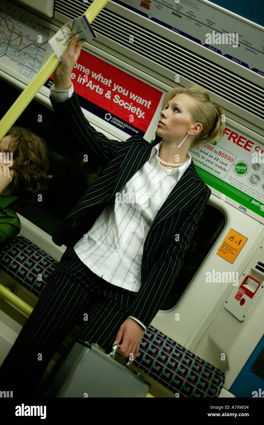 Woman alone on subway Stock Photo