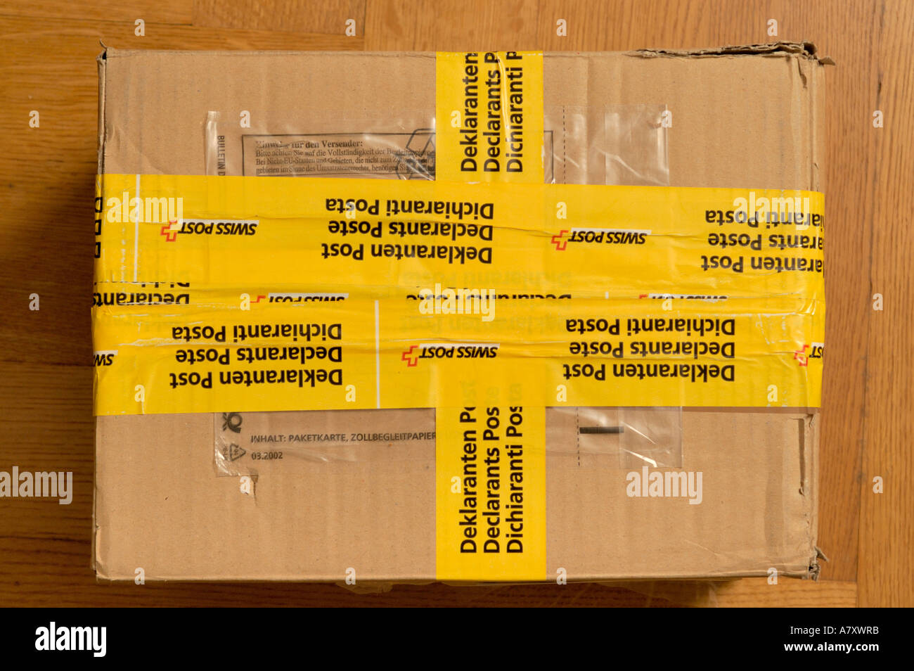 opened and repackaged parcel by swiss customs. has been opened by customs for content verification. (c) by uli nusko, ch-3012 be Stock Photo