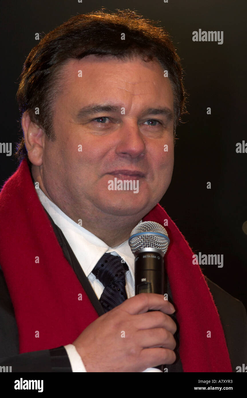 Tv Presenter Eamonn Holmes With Microphone On Stage With Black Coat And Red Scarf Belfast Northern Ireland Tv Presenter Eamonn Holmes With Microphone On Stage With Black Coat And Red Scarf Belfast Northern Ireland