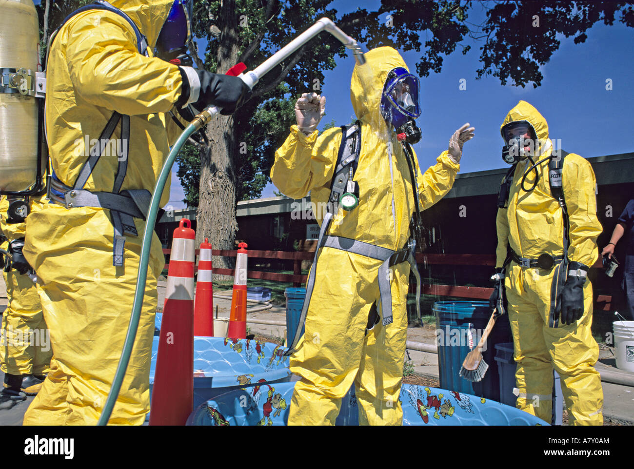 Hazmat team washes member in decontamination line Stock Photo Alamy