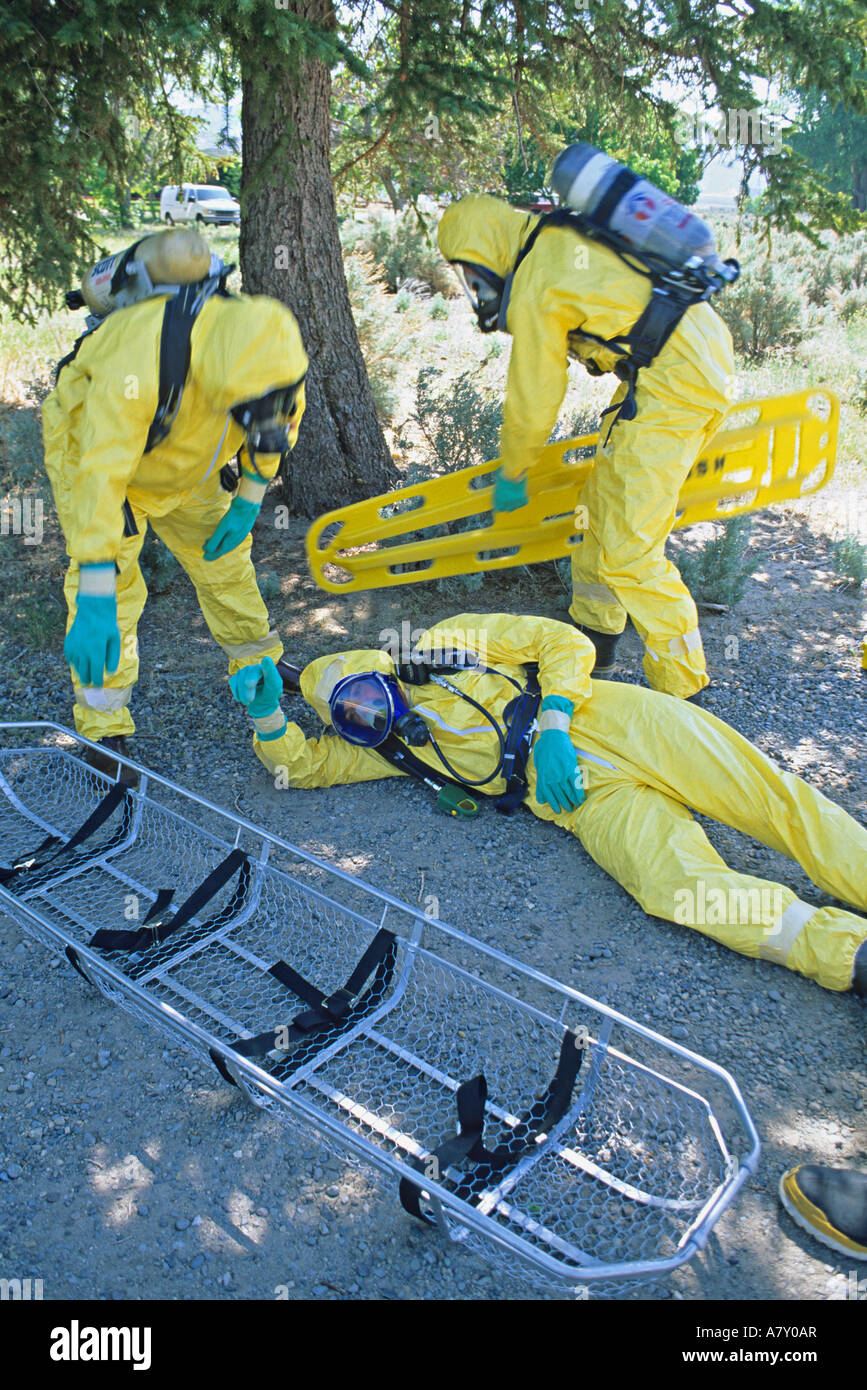 Hazmat team rescues member overcome by toxic substance Stock Photo - Alamy