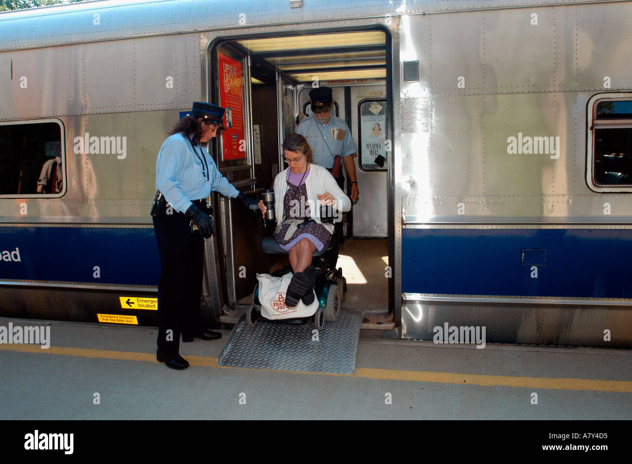 Wheelchair bound woman departs Metro North at Hartsdale Station Stock