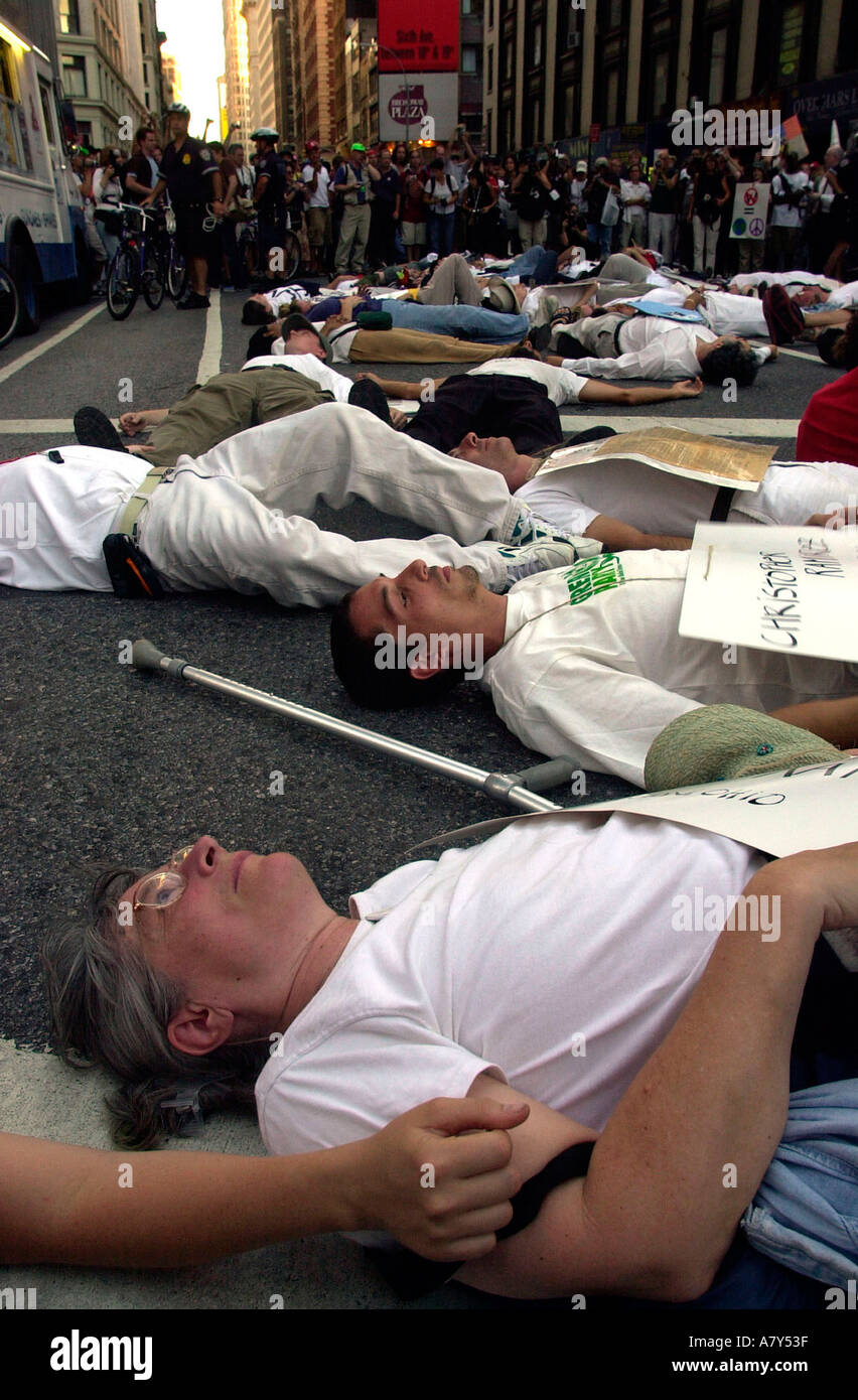 Demonstrators from the War Resisters League perform civil disobedience The signs they wear have the names of the fallen soldiers in Iraq Stock Photo