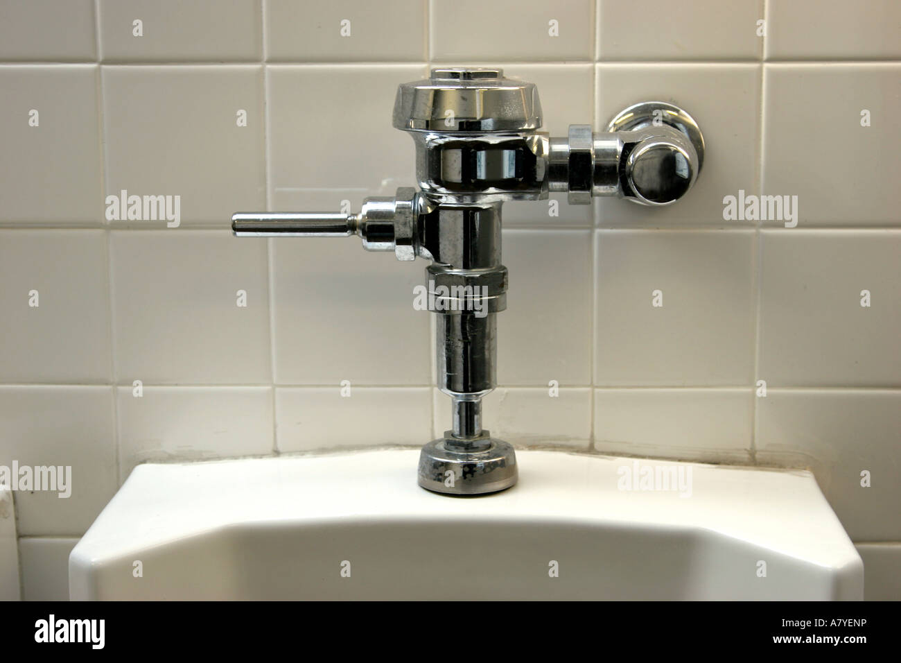 Closeup of chrome urinal handle Stock Photo Alamy