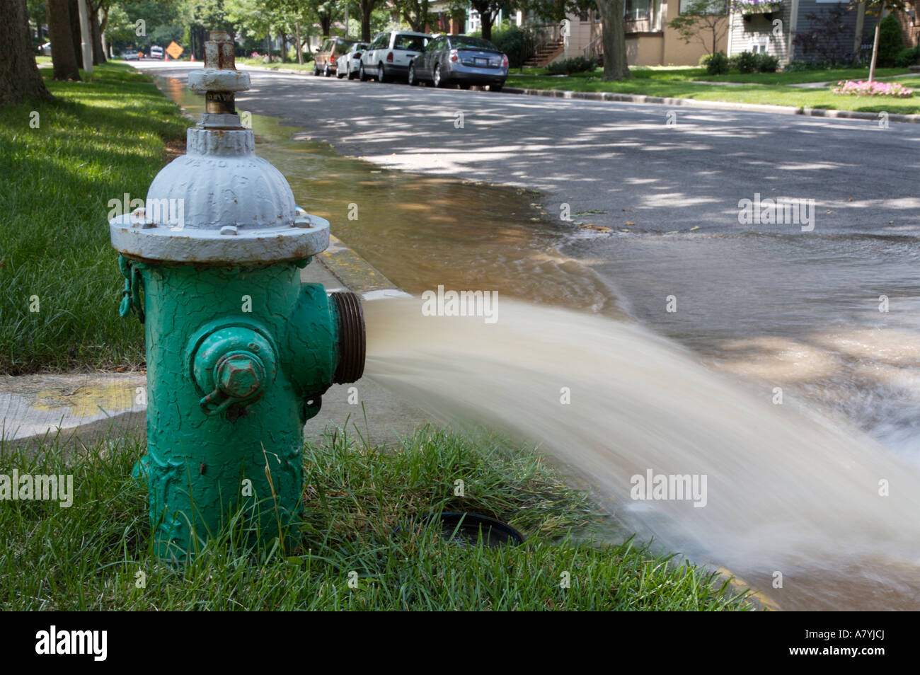 Open fire hydrant Stock Photo Alamy