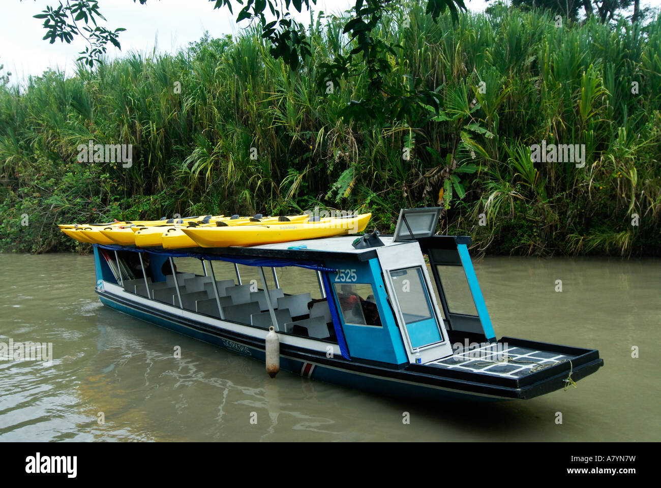 Costa Rica, transporting kayaks by boat Stock Photo