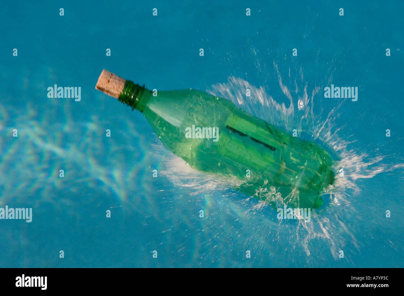 bottle with cork splashing into water Stock Photo Alamy