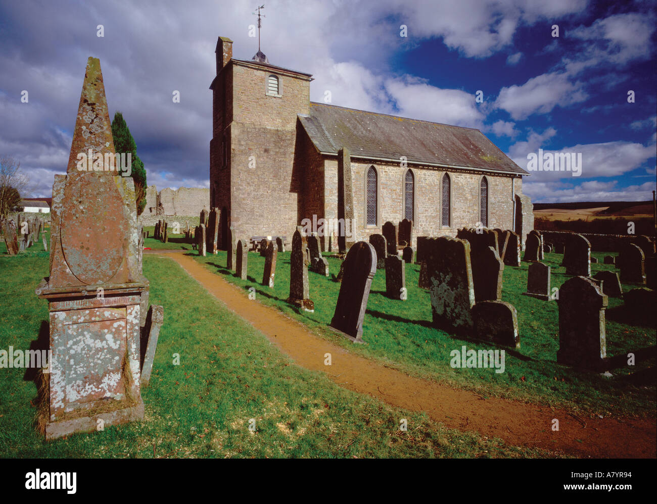 St Cuthbert's Church and The Bewcastle Cross, Bewcastle, Cumbria, United Kingdom Stock Photo